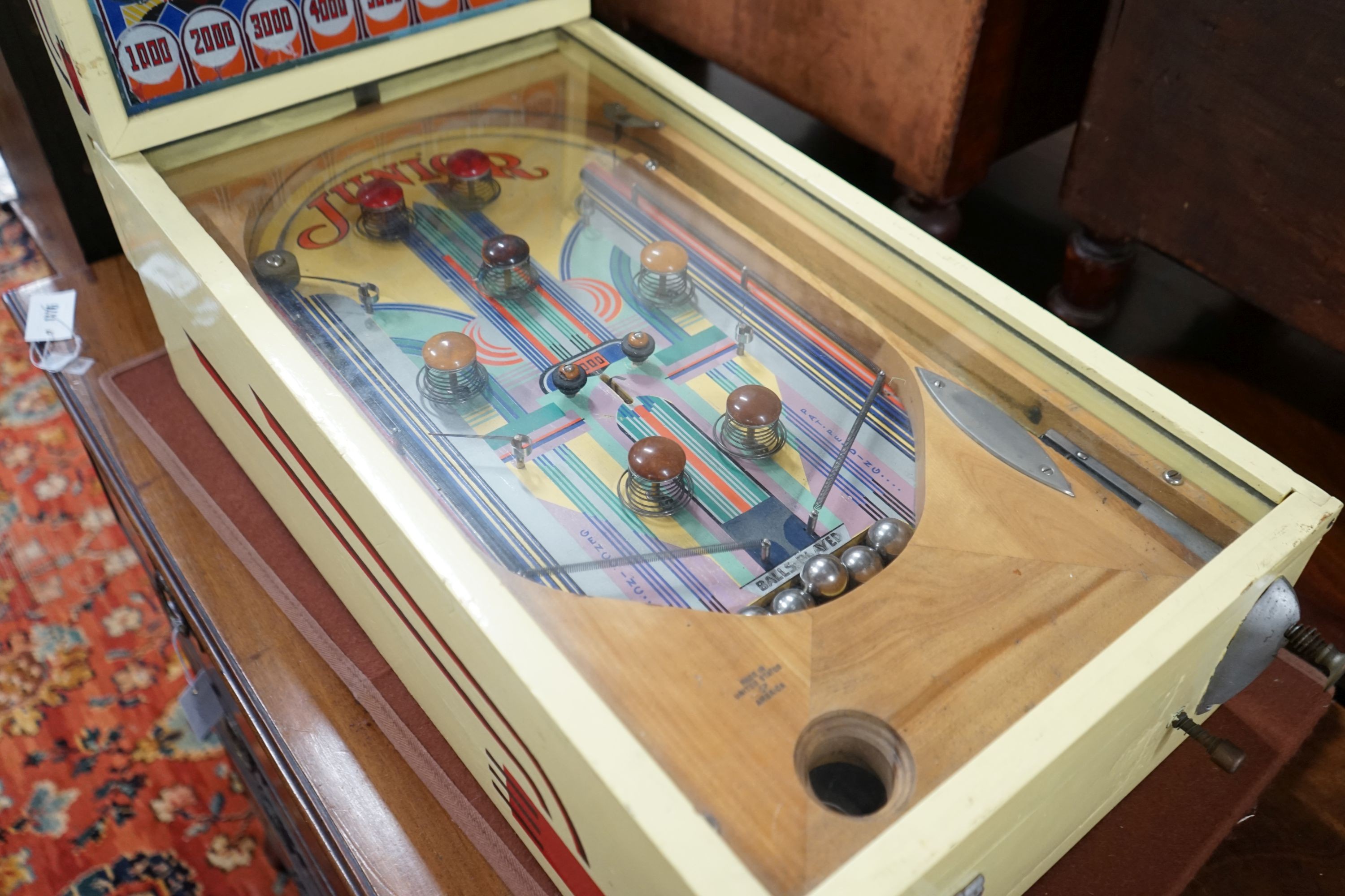 A vintage American 'Junior' pinball machine, width 39cm, length 72cm, height 45cm, ITEM ONLY A COLLECTOR'S ITEM - REWIRE REQUIRED BEFORE USE